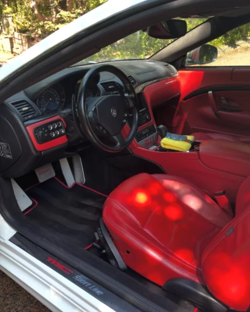 The red leather interior of a Maserati GranTurismo