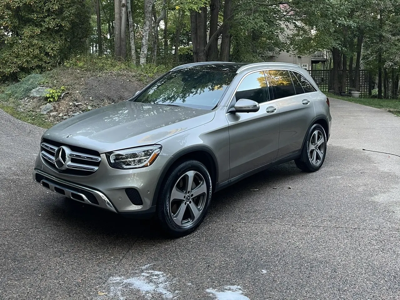 A silver Mercedes-Benz GLC on a driveway