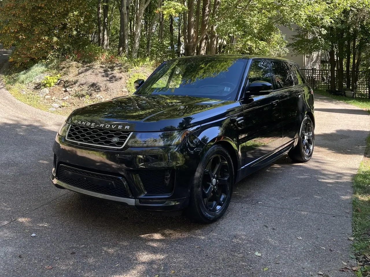 A black Range Rover Sport on a driveway